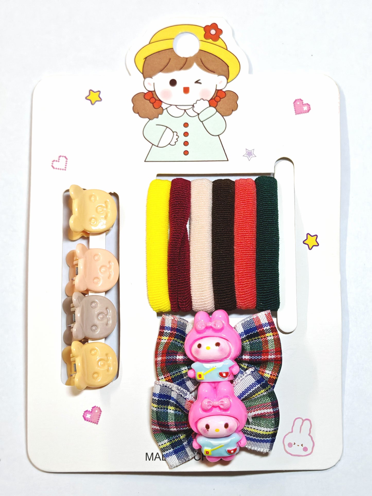 Set of colorful hair ties and clips on a with cartoon character