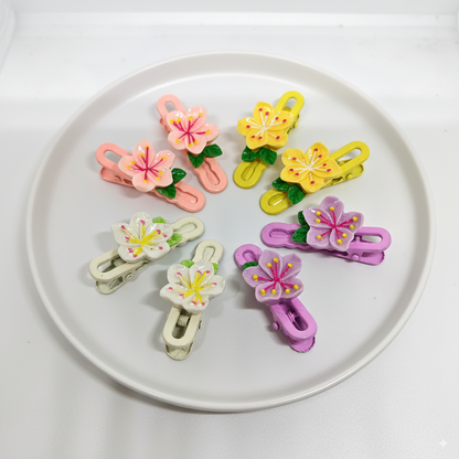 Colorful flower-shaped clips on a white plate